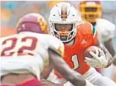  ?? JIM RASSOL/STAFF PHOTOGRAPH­ER ?? Hurricanes running back Mark Walton suffered a bruised knee in the first half against Bethune-Cookman, but was not limited in the second half.