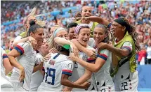  ?? GETTY IMAGES ?? Megan Rapinoe, of the USA, celebrates with teammates after scoring her team’s first goal during the 2019 FIFA Women’s World Cup final in France earlier this month.