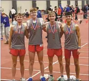  ?? ?? Shelby boys track team members shown earlier this month at an indoor track event. Shown left to right are Sean Finnegan, Indy Mayer, Marshall Moore, and Luke Lesseuer. They are coached by Chris Zuercher.