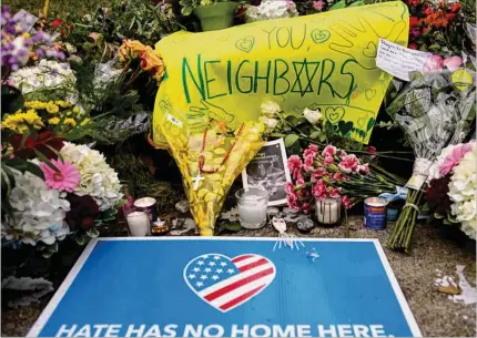  ?? COURTESY ?? Flowers and cards are shown at a makeshift memorial down the street from the site of the 2018 mass shooting that killed 11 people and wounded 6 at the Tree Of Life Synagogue in Pittsburgh. Gunman Richard Bowers was found guilty and sentenced to death earlier this year.