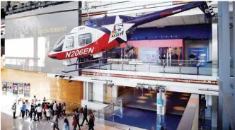  ??  ?? A news chopper hangs inside the lobby of the Newseum on Pennsylvan­ia Avenue which will be closing down on New Year’s Eve after 12 years in Washington, on Dec 19, 2019. —AFP photos