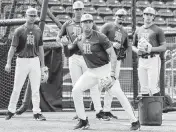  ?? AL DIAZ adiaz@miamiheral­d.com ?? UM infielder Antonio Jimenez, a freshman from Davie, fields the ball during drills Tuesday at Mark Light Field.