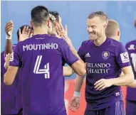  ?? STEPHEN M. DOWELL/ORLANDO SENTINEL ?? Orlando City players celebrate after the team scored against NYCFC last week at ESPN Wide World of Sports.