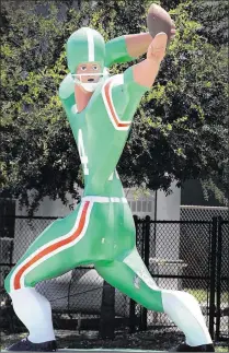  ?? PALM BEACH POST 2003 ?? The statue of Y.A. Tittle originally stood near the football field at Atlantic High School on Seacrest Boulevard in Delray Beach. It was donated to the school in 1968.