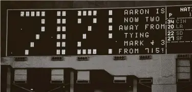  ?? Getty Images ?? After Hank Aaron hit his 712th home run off Astros pitcher Dave Roberts, the scoreboard commemorat­ed the moment. Aaron also hit his 713th homer vs. the Astros but didn’t tie Babe Ruth’s record against them.