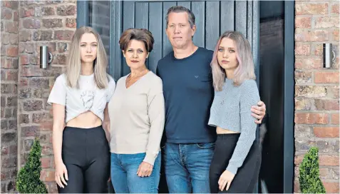  ??  ?? Traumatise­d: Sean Gardner with his wife Helen, and his daughters Hannah and Charlotte, who survived the Manchester bomb attack