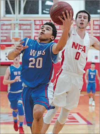  ?? DANA JENSEN/THE DAY ?? Waterford’s J.J. Brennan (20) beats NFA’s NFA’s Brenden Sholes down the court on the fast break during Friday night’s game before a full house at Alumni Hall. The Lancers outlasted the Wildcats 80-77.