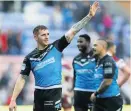  ??  ?? Sneyd salutes the crowd after sealing dramatic victory