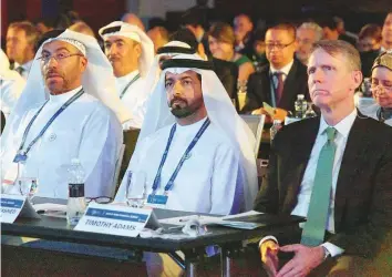  ?? Abdul Rahman/Gulf News ?? From left: Ahmad Al Sayegh, Minister of State and chairman of the Abu Dhabi Global Market, Mubarak Rashed Al Mansouri, UAE Central Bank governor, and Tim Adams, president and CEO of the IIF, at the 2018 IIF Mena Financial Summit on Al Maryah Island, Abu Dhabi, yesterday.