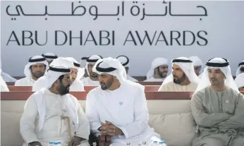  ?? Ryan Carter for the Crown Prince Court – Abu Dhabi ?? Sheikh Mohammed bin Zayed, Sheikh Hazza bin Zayed, Vice Chairman of the Abu Dhabi Executive Council, and Sheikh Tahnoon bin Mohammed, Ruler’s Representa­tive in the Eastern Region, at the Abu Dhabi Awards yesterday