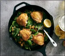  ?? DAVID MALOSH — THE NEW YORK TIMES ?? One-pan crispy chicken and chickpeas. Add spices to the chicken if you like, but definitely serve the dish with yogurt, hot sauce or both, as Yossy Arefi recommends.