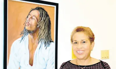  ?? ?? Attorney-at-law and artist Crislyn Beecher-Bravo’s ‘Soul Rebel’ portrait of Marley was inspired by a photo.
