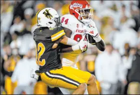  ?? David Zalubowski The Associated Press ?? Fresno State tight end Tre Watson and the Bulldogs are 7½-point favorites when they host UNLV on Saturday.