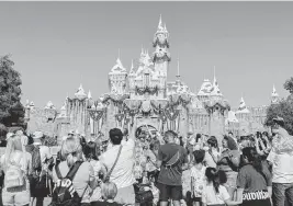  ?? ALEX WELSH NYT ?? Under a 40-year plan, Disney has promised to invest at least $1.9 billion over the next decade to improve Disneyland in Anaheim, Calif. The theme park’s footprint would not expand, except that Disney will buy three public streets from Anaheim for $40 million.
