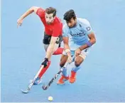  ??  ?? India’s Surender Kumar and Canada’s Iain Smythe in action during the Men’s World Hockey League Semi-final, 5th/6th place match