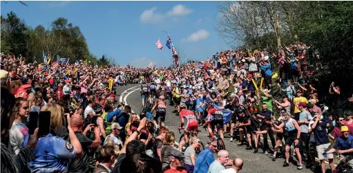  ??  ?? The Tour de Yorkshire attracts roadside visitors in their thousands