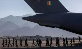  ??  ?? Indian soldiers disembark from a military transport plane at a forward airbase in Leh, Ladakh. Photograph: Danish Siddiqui/Reuters