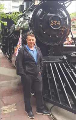  ?? Special to The Herald ?? Mike Pearce, mayor of Penticton from 1999-2002, is pictured beside a historic train in White Rock, where he’s resided for the past several years.