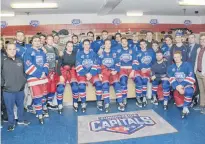  ?? JASON MALLOY/SALTWIRE NETWORK ?? Summerside native Brodie MacArthur, centre, with his teammates during the first intermissi­on of Thursday’s record-setting game with the Grand Falls Rapids.