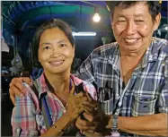  ?? AP PHOTO BY SAKCHAI LALIT ?? Family members smile after hearing the news that the missing 12 boys and their soccer coach have been found, in Mae Sai, Chiang Rai province, in northern Thailand, Monday, July 2.