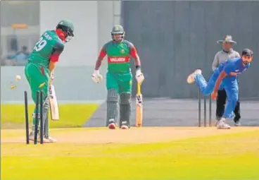  ?? DEEPAK GUPTA/HT ?? ■ India’s Atit Seth (right) uproots the middle stumps of Bangladesh’s opener Saif Hasan in Lucknow on Friday.