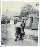  ?? ?? Frank’s turn on the new bike while Pete gives him a push.