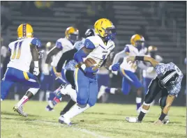  ??  ?? Thomas Stone’s Trent Gaskins carries the ball during the Cougars’ game at Huntingtow­n on Friday night. Gaskins rushed for 181 yards and a touchdown in Stone’s 36-7 loss to the Hurricanes.