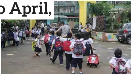  ?? (JOEY O. RAZON/PNA) ?? A teacher leads her pupils to the gate where parents are waiting to fetch their children at Pinyahan Elementary School in Quezon City