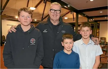  ?? ROBYN EDIE/STUFF ?? Sir John Kirwan is pictured with the Cairns siblings, from left, Ben Cairns, 13, Sam, 9, and Matthew, 12, at the Ascot Park Hotel yesterday, as he was speaking about his mental health programme Mitey.