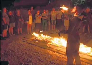  ??  ?? A firewalk was organised on behalf of Ashford ASD charity at the Beaver Inn