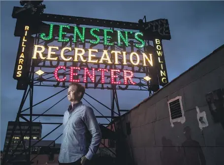  ?? Gina Ferazzi Los Angeles Times ?? THE SIGN lights up in programmed sequence. “We wanted to do our part to restore an important part of that property,” said Nick Clement, vice president at Vista Investment Group, which bought Jensen’s Recreation Center, the 1920s building where the...