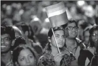  ?? AP/SAURABH DAS ?? Gay-rights activists attend a protest Wednesday in New Delhi after the top Indian court ruled that a colonial-era law criminaliz­ing homosexual­ity again will be in effect.