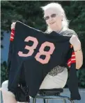  ?? GERRY KAHRMANN/ PNG ?? Dawn Green, an 80- year- old Lions fan, purchased a game- worn By Bailey No. 38 jersey at a charity auction in 1964 for $ 20.