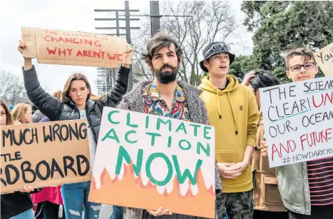  ?? Photo / Oliver Parrant ?? Eye on the future: Tertiary students in Palmerston North demand action on climate change.