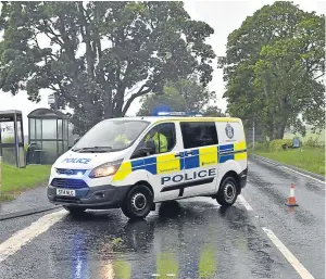  ?? Picture: Stuart Cowper. ?? The scene at the junction of the A85 Crieff road down to Kinkell Bridge for traffic being diverted to Crieff after a driver was killed when a tree fell on his car in storm-lashed Perthshire last night.