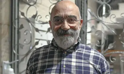  ??  ?? Turkish journalist and writer Ahmet Altan at his home following his release from jail. Photograph: Bülent Kılıç/AFP/Getty
