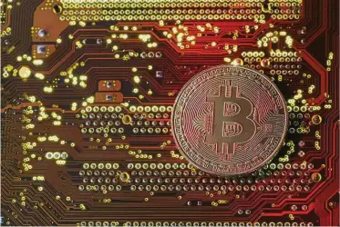  ??  ?? Up and up: While the actual volume of transactio­ns conducted in cryptocurr­encies is relatively small, the optimism surroundin­g the technology continues to drive it to new highs. — Reuters