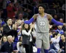  ?? MATT SLOCUM — THE ASSOCIATED PRESS ?? 76ers forward Robert Covington reacts during the second half against the Charlotte Hornets on Friday in Philadelph­ia. The Sixers won, 133-132, in overtime.