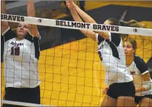  ?? ?? Hailey Cole (left) and Alyssa Gumbel (right) go up for a block.