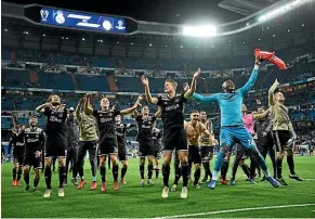  ?? GETTY IMAGES ?? Ajax players celebrate their famous 4-1 victory over Real Madrid. Ajax, who lost the Champions League round of 16 first leg 2-1, completed a remarkable turnaround to advance 5-3 on aggregate.