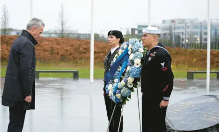  ?? VIRGINIA MAYO/AP ?? NATO Secretary-General Jens Stoltenber­g, left, attends a wreath-laying ceremony Thursday in Brussels.