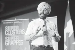  ?? FRED CHARTRAND THE CANADIAN PRESS ?? Navdeep Bains, Minister of Innovation, Science and Economic Developmen­t announces proposals under the $950-million Innovation Superclust­ers Initiative.