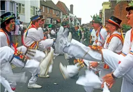  ??  ?? Below: Colourful costumes and celebratio­ns are all part of the Jack in the Green Festival at Hastings in Sussex.