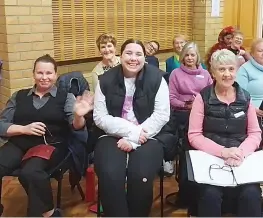  ?? ?? Above: A happy group of Baw Baw Singers sopranos ready to sing, including the newly-engaged Bethany Allan (front centre).
Left: Women on Farms members Jean Irvine and Rikki van Rensch admire Rosa Wedmore’s honey handling know-how.