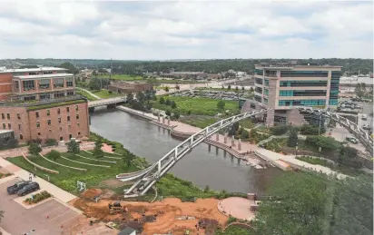  ?? ERIN BORMETT/ARGUS LEADER ?? The Arc of Dreams and the Big Sioux River fill the view on the north side of River Tower Apartments in Sioux Falls.