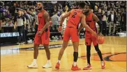  ?? DAVID JABLONSKI / STAFF ?? Dayton players (left to right) Trey Landers, Ibi Watson and Jalen Crutcher led the Flyers to an 18-0 conference finish, a 29-2 record and a No. 3 ranking.