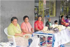  ?? Picture: ANASEINI DIMATE ?? Ladies sell their pastries at the Suva Municipal Market.