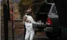  ??  ?? Brett Bizzle comforts his wife, Vanthy, who became emotional after returning to the remains of their home for the first time since the Camp fire forced them to evacuate Paradise. Photograph: Elijah Nouvelage/Reuters