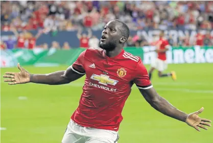  ??  ?? Manchester United’s Romelu Lukaku reacts after scoring a goal against Manchester City in Houston.