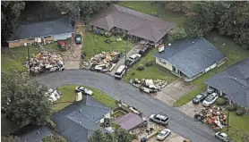  ?? MAX BECHERER/AP ?? Costs and debris pile up as the Baton Rouge, La., area recovers from catastroph­ic flooding from an August storm.